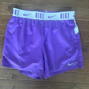 Nike Dri-fit, standard fit. Size Youth Large. Bright purple/lavendar/silver